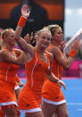LONDON, ENGLAND - JULY 29: Maartje Goderie of Netherlands and herteam mates celebrate victory at the end of the Women's Pool WA Match W02 between the Netherlands and Belgium at the Hockey Centre on July 29, 2012 in London, England. (Photo by Daniel Berehulak/Getty Images)