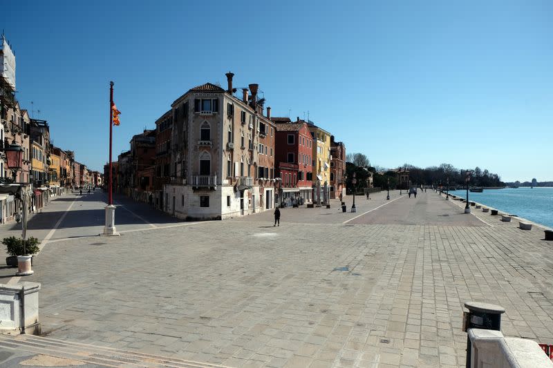 An empty street is seen in Venice on Sunday with an unprecedented lockdown across of all Italy imposed to slow the outbreak of coronavirus