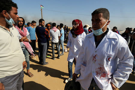 FILE PHOTO - Female Palestinian medic Razan Al-Najar works at the scene of clashes at Israel-Gaza border, in the southern Gaza Strip April 1, 2018. REUTERS/Ibraheem Abu Mustafa/File Photo
