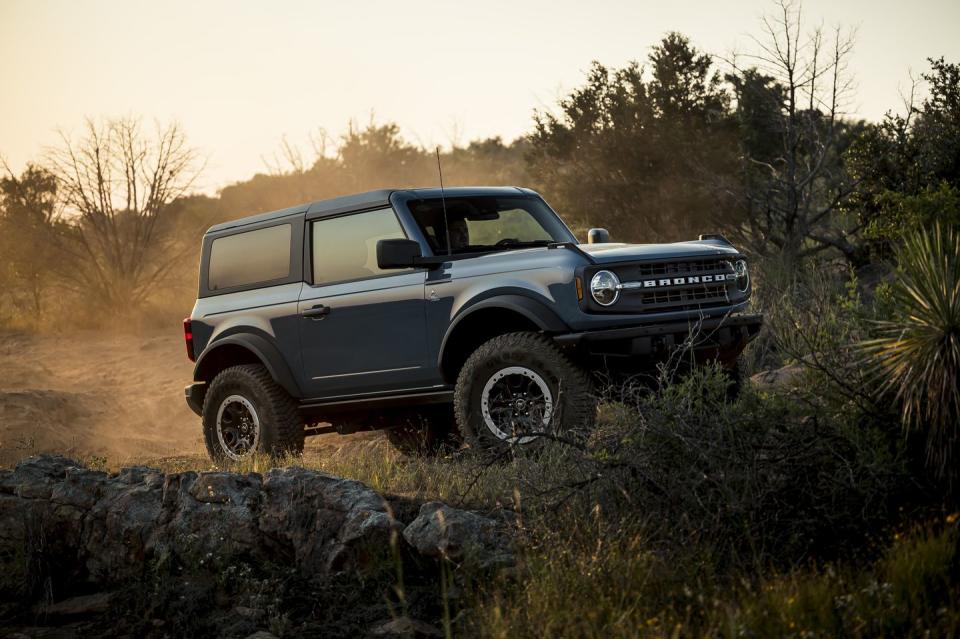 ford bronco driving outdoors