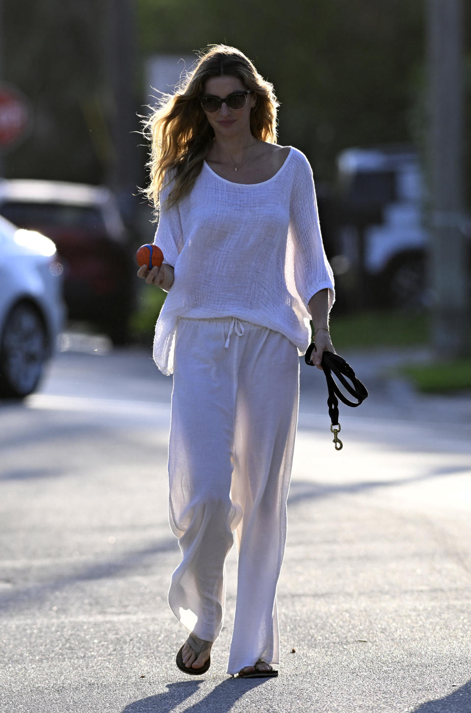 Gisele Bündchen spends time with her son Benjamin while wearing a sheer outfit while walking her German Shepherd in Surfside, Florida. 17 Mar 2024 Pictured: Gisele Bündchen, Benjamin Brady. Photo credit: MEGA TheMegaAgency.com +1 888 505 6342 (Mega Agency TagID: MEGA1112183_028.jpg) [Photo via Mega Agency]