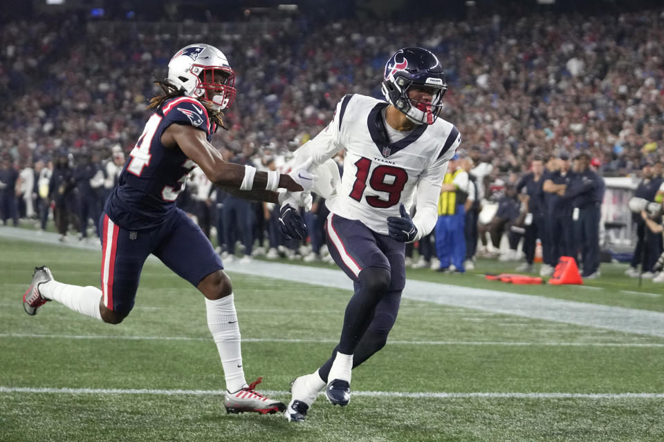 FILE - Houston Texans wide receiver Xavier Hutchinson (19) is pursued into the end zone by New England Patriots cornerback Quandre Mosely during the second half of an NFL preseason football game Aug. 10, 2023, in Foxborough, Mass. Hutchinson, a sixth-round pick out of Iowa State, is among the players fighting to earn a roster spot. (AP Photo/Steven Senne, File)