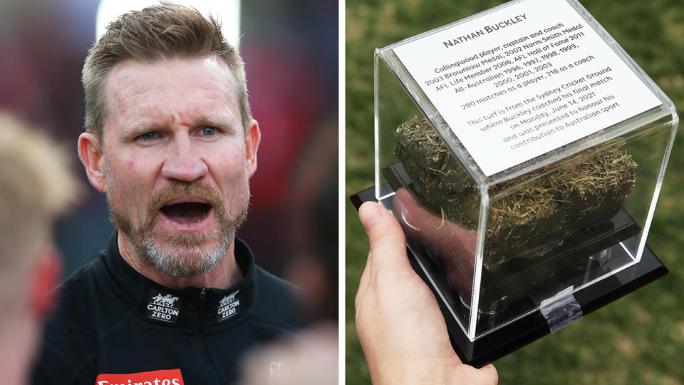 Before his final game as coach of Collingwood, the SGC trust presented Nathan Buckley with a chunk of turf from the ground as a memento. Pictures: Getty Images