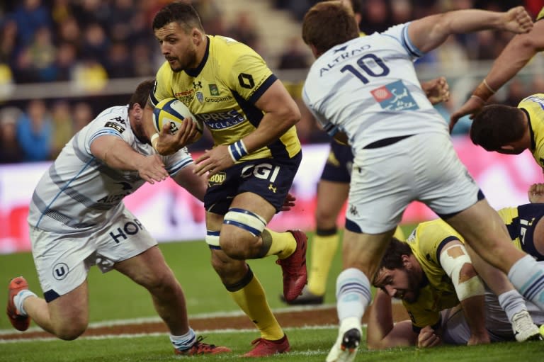 Clermont's flanker Damien Chouly (2L) tries to escape the tackle from Montpellier players during the French Top 14 rugby union match ASM Clermont vs MHR Montpellier at the Michelin stadium in Clermont-Ferrand, central France, on March 12, 2017