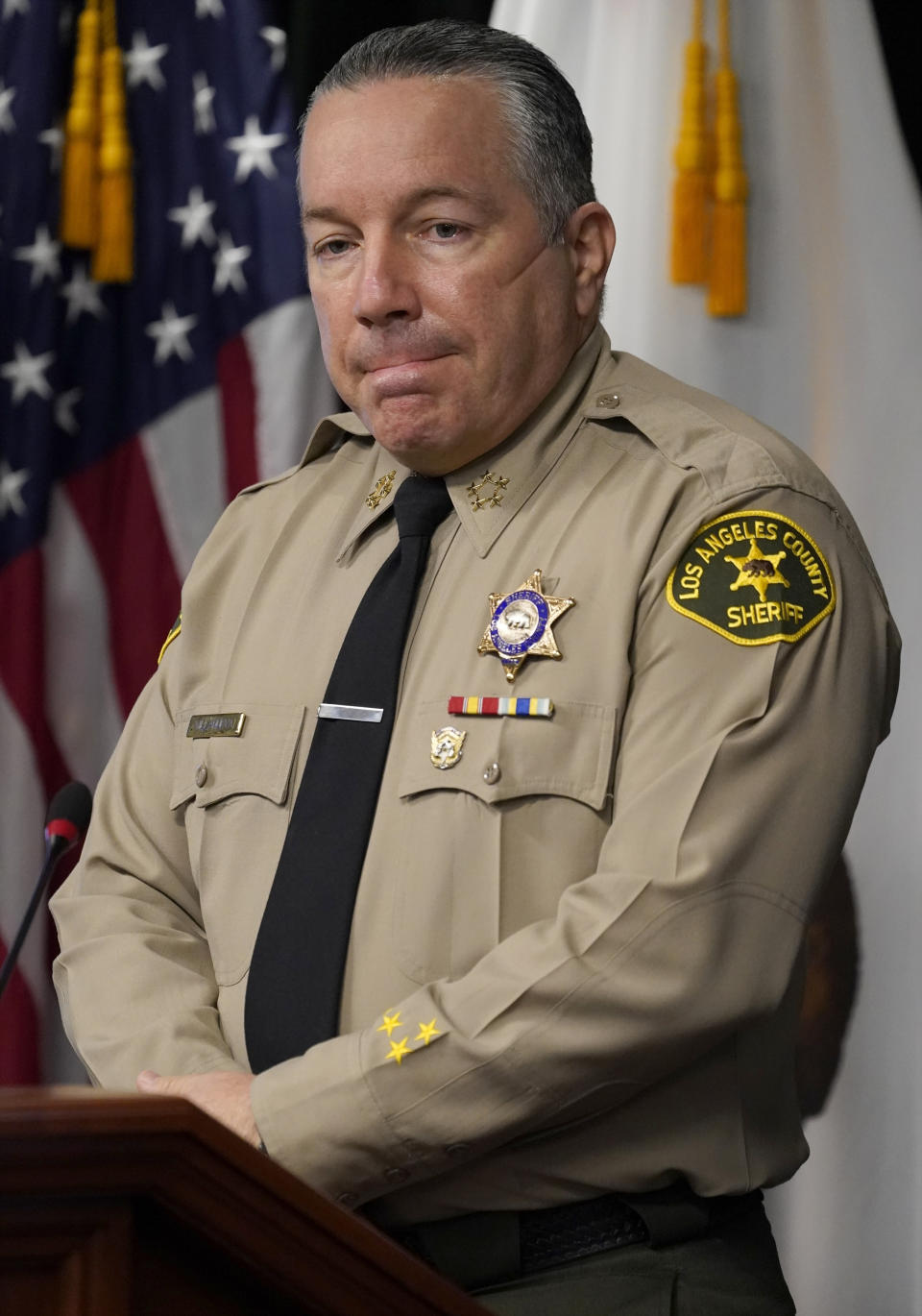 FILE - In this Sept. 17, 2020, file photo, Los Angeles County Sheriff Alex Villanueva comments on the shooting of 29-year-old Dijon Kizzee, who was killed by deputies following a scuffle, during a news conference at the Hall of Justice in downtown Los Angeles. The California Department of Justice has opened a civil rights investigation to determine whether the Los Angeles County Sheriff’s Department has engaged in a pattern or practice of unconstitutional policing, California Attorney General Xavier Becerra announced Friday, Jan. 22, 2021. (AP Photo/Damian Dovarganes, File)