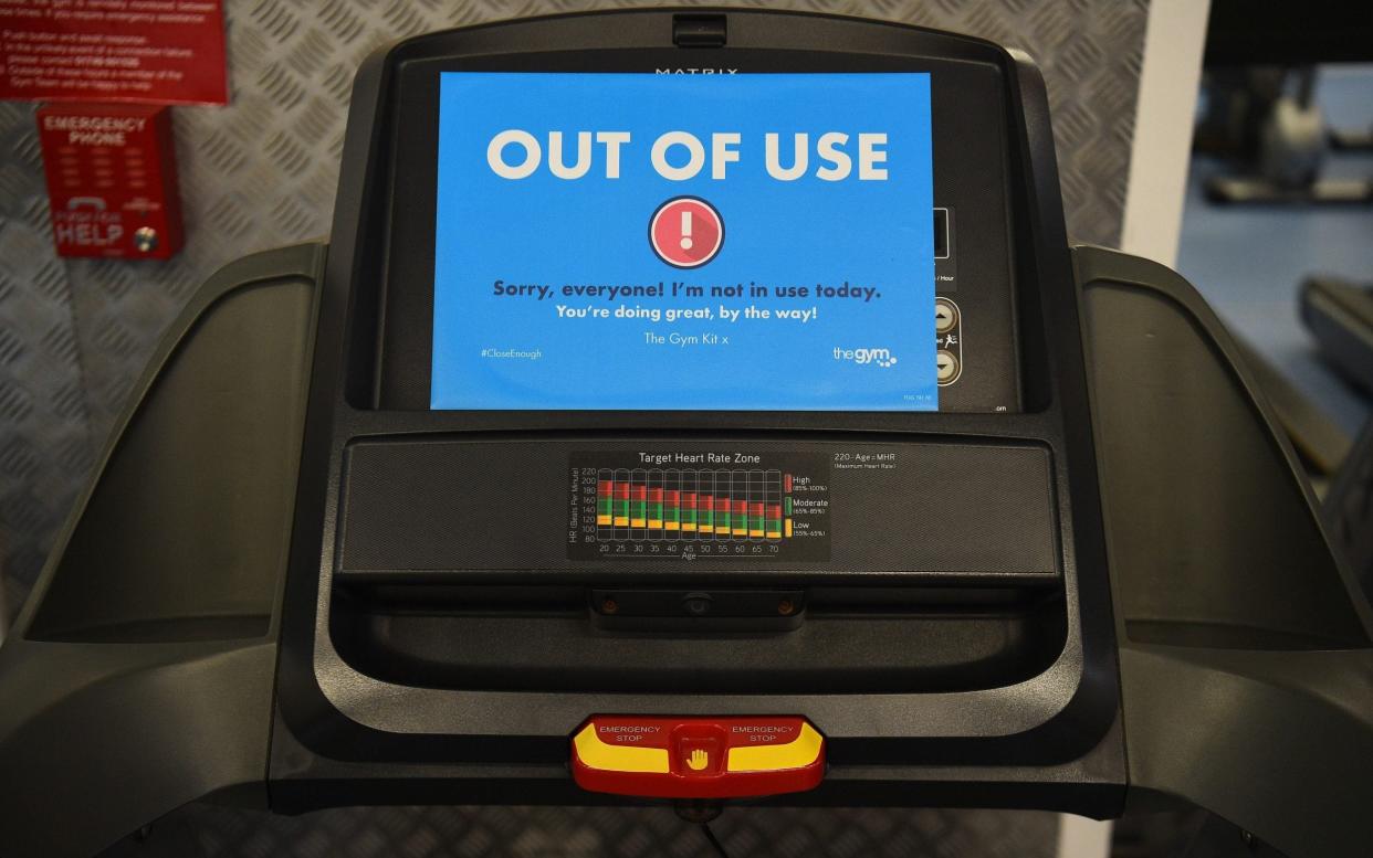 An 'Out Of Use' marker on an exercise machine inside The Gym Group