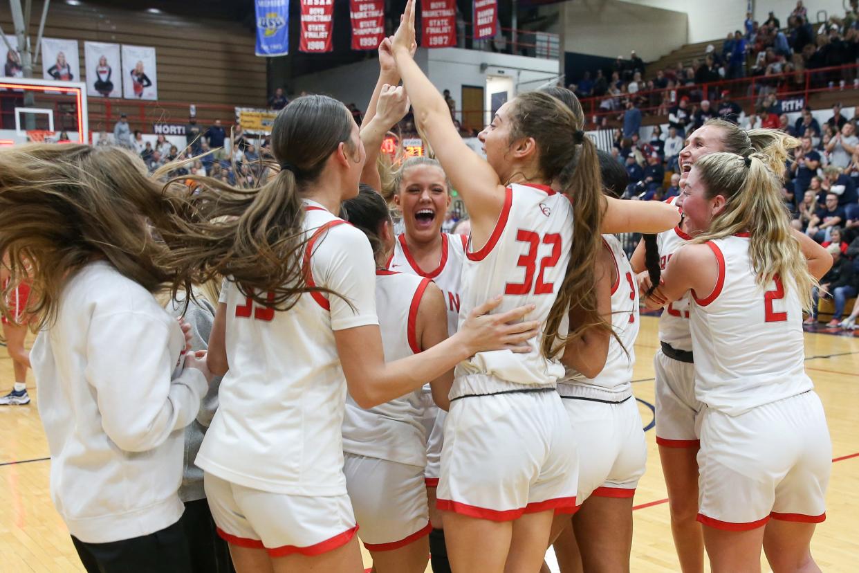 Center Grove players celebrate their victory as Bedford North Lawrence took on Center Grove High School in the Girls Class 4A IHSAA Region 7 basketball championship, Feb 10, 2024; Bedford, IN, USA; at Bedford North Lawrence High School.