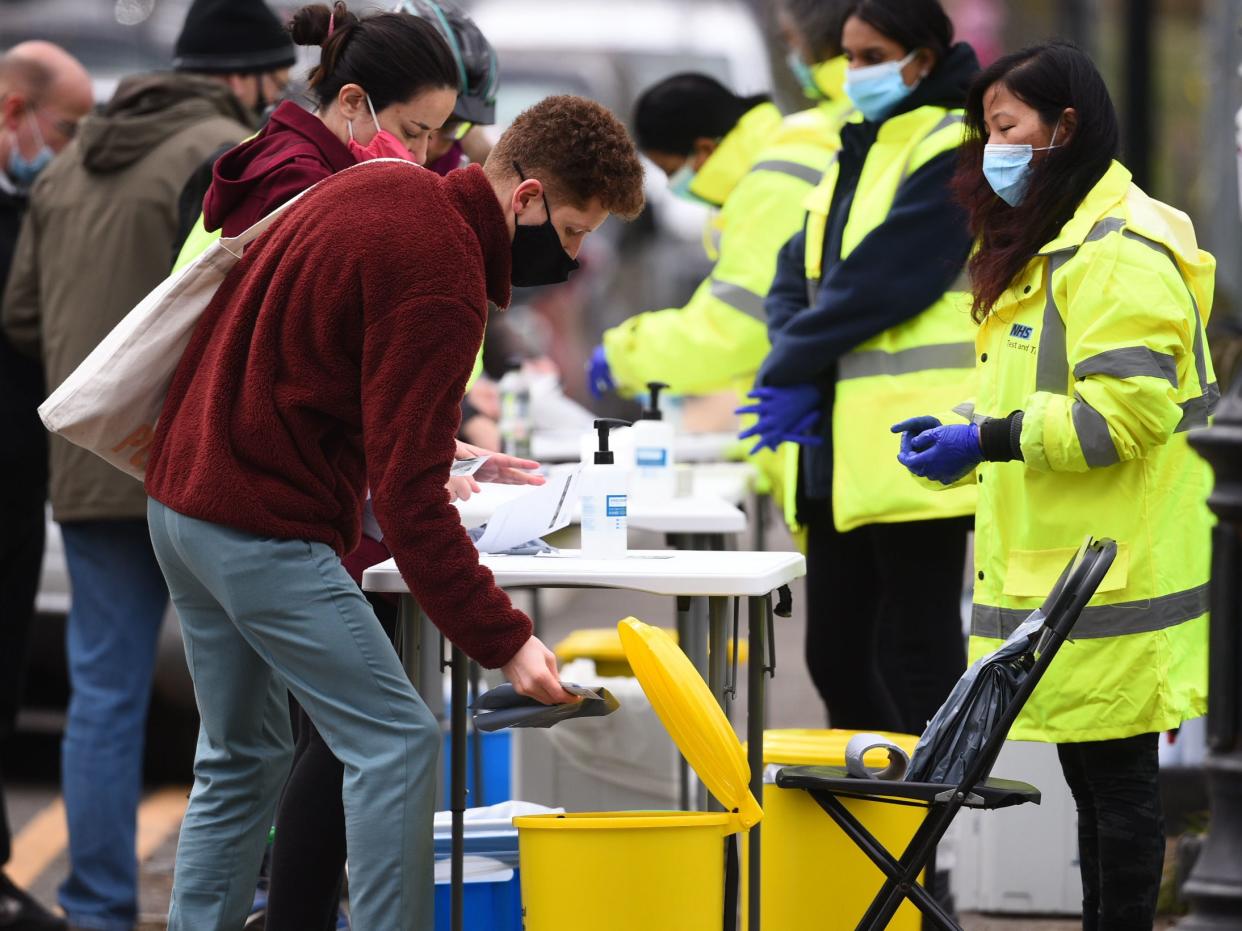 People take part in coronavirus surge testing on Clapham Common, south London (PA)
