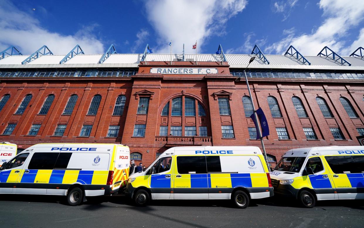 Police vehicles parked outside the ground ahead of the Rangers vs Celtic match at Ibrox Stadium