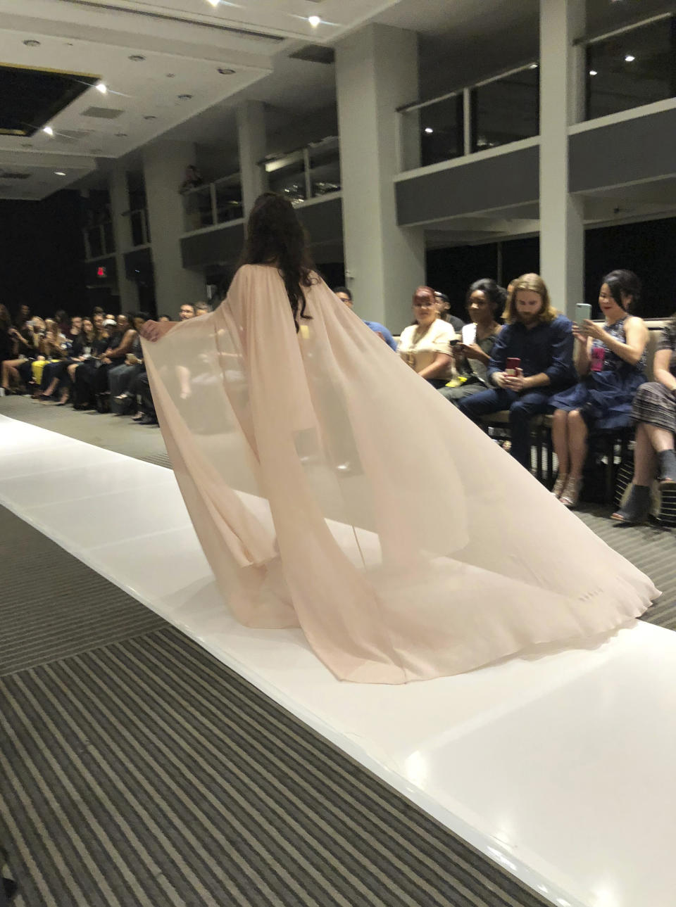 Model Marian Avila wears an outfit from the Talisha White 2019 spring collection on the runway during Fashion Week, Saturday, Sept. 8, 2018, in New York. Avila, a 21-year-old Spanish model with Down syndrome, fulfilled her dream to walk at New York Fashion Week thanks to White, the Atlanta designer she met through the magic of social media. (AP Photo/Leanne Italie)