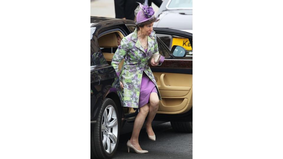 Princess Anne frowning and smiling as she got out of the car at Prince William's wedding