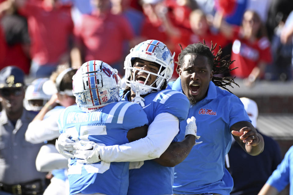 Mississippi safeties Trey Washington, left, and John Saunders Jr. celebrate after an NCAA college football game against Texas A&M in Oxford, Miss., Saturday, Nov. 4, 2023. Mississippi won 38-35. (AP Photo/Thomas Graning)