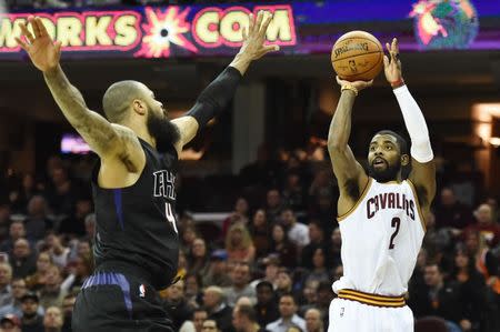 Jan 19, 2017; Cleveland, OH, USA; Cleveland Cavaliers guard Kyrie Irving (2) shoots over the defense of Phoenix Suns center Tyson Chandler (4) during the first half at Quicken Loans Arena. Mandatory Credit: Ken Blaze-USA TODAY Sports