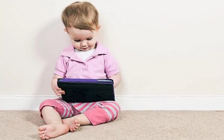 Children under 18 months should not be given handheld devices  - Alamy 