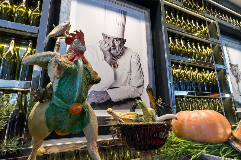 FILE PHOTO: French chef Paul Bocuse's portrait is seen during a press visit for the opening of the new restaurant-school of the Institut Paul Bocuse in Lyon