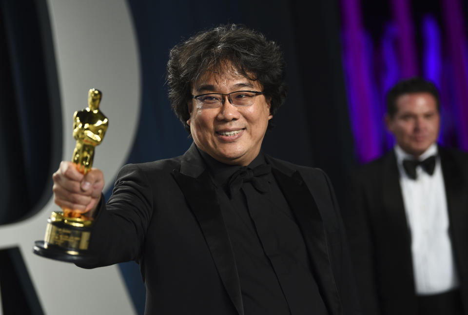 Bong Joon-ho, winner of the awards for best original screenplay, best international feature film, best directing, and best picture for "Parasite," arrives at the Vanity Fair Oscar Party on Sunday, Feb. 9, 2020, in Beverly Hills, Calif. (Photo by Evan Agostini/Invision/AP)