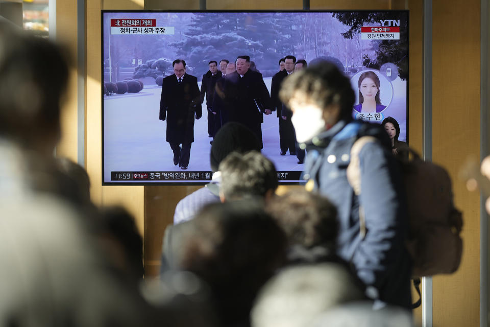 A TV screen shows a news program reporting with footage of North Korean leader Kim Jong Un in Pyongyang, at the Seoul Railway Station in Seoul, South Korea, Tuesday, Dec. 27, 2022. North Korean leader Kim called for stronger effort to overcome hardships and challenges facing his country as he opened a key political meeting after carrying out a record number of missile tests this year. (AP Photo/Lee Jin-man)