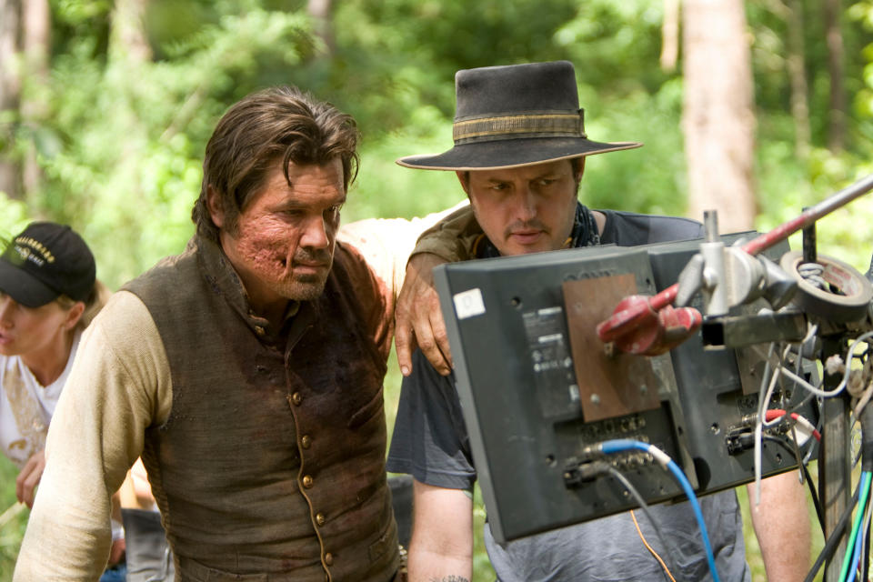 JOSH BROLIN and director JIMMY HAYWARD watch a playback on the set of Warner Bros. Pictures’ and Legendary Pictures’ action adventure “JONAH HEX,” a Warner Bros. Pictures release. TM & © DC Comics.