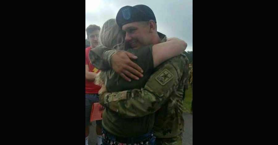 Euclid officer Jacob Derbin hugging his mother after serving a tour overseas with the Army National Guard