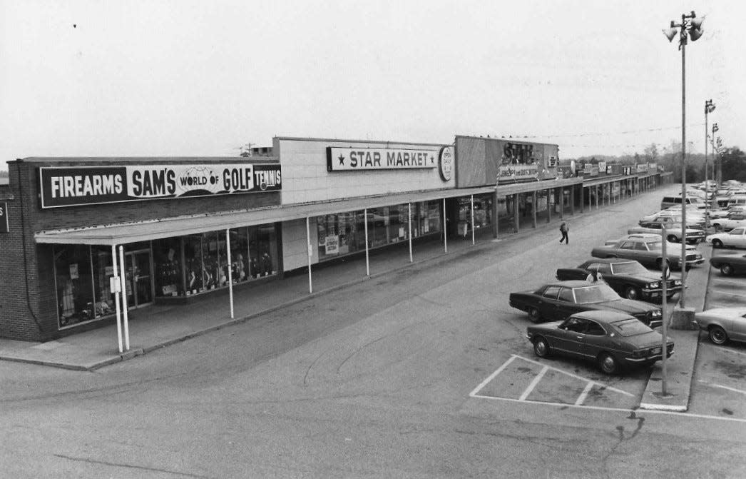 Midway Plaza, pictured in 1977, straddles the Tallmadge-Akron line. The building and first two rows of parking are in Tallmadge while the rest of the parking lot is in Akron.