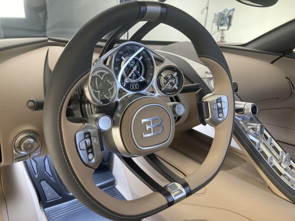 the steering wheel and dashboard of a car