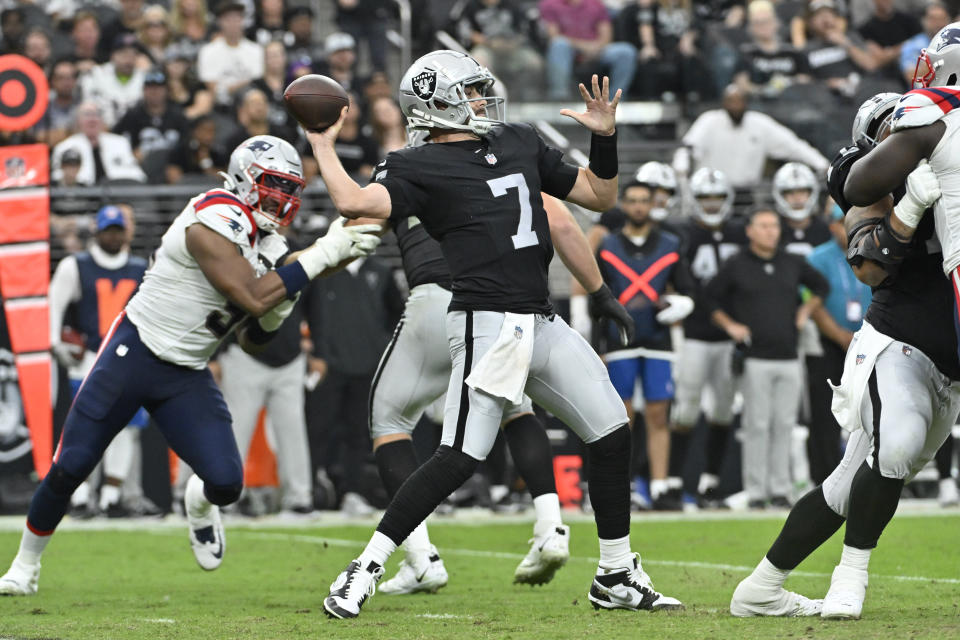 Las Vegas Raiders quarterback Brian Hoyer throws a pass during the second half of an NFL football game against the New England Patriots, Sunday, Oct. 15, 2023, in Las Vegas. (AP Photo/David Becker)