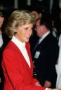 <p>The Princess wore a red Catherine Walker skirt suit paired with a white, collarless button-up shirt. </p>