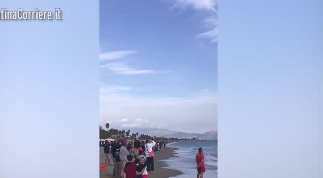 The shocked crowd had gathered on the beach to watch the show. Photo: LatinaCorriere it