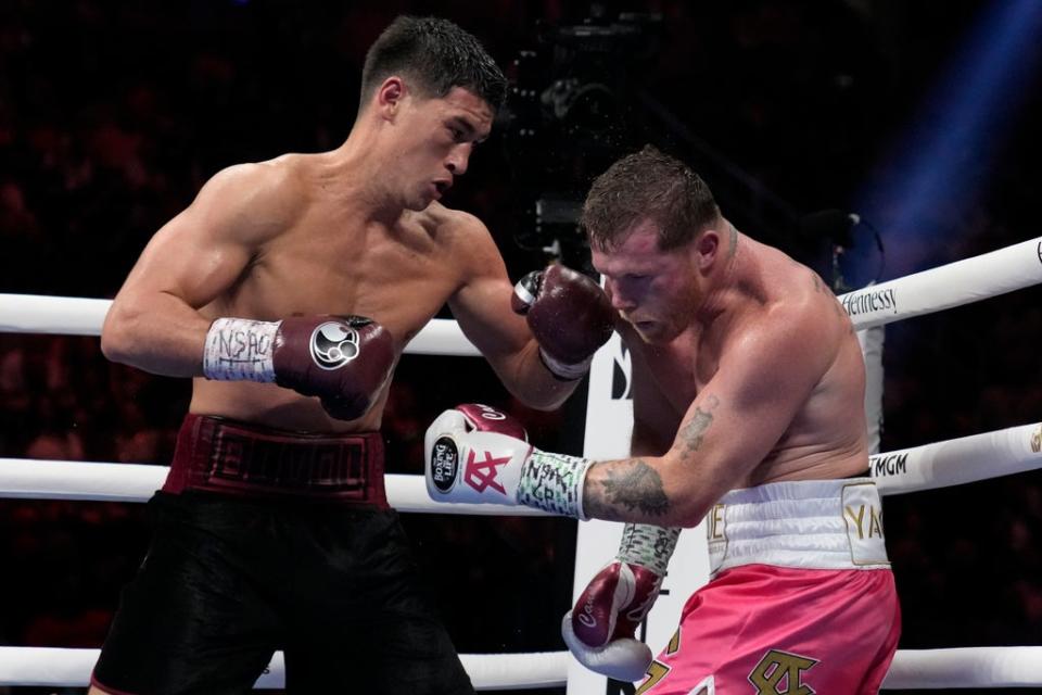 Dmitry Bivol (left) earned a unanimous-decision win against Canelo (Copyright 2022 The Associated Press. All rights reserved.)