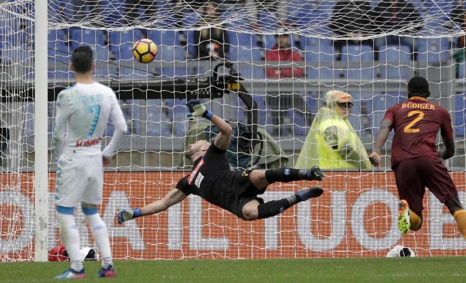 Napoli goalkeeper Pepe Reina is airborne as he saves a shot during a Serie A soccer match between Roma and Napoli, at the Rome Olympic stadium, Saturday, March 4, 2017. Napoli won 2-1.(AP Photo/Gregorio Borgia)