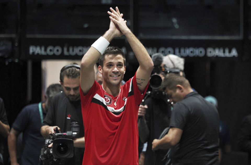 Canada's Alexis Galarneau celebrates after defeating Chile's Alejandro Tabilo during the men's single Davis Cup group A tennis match between Chile and Canada, in Bologna, Saturday Sept. 16, 2023. (Michele Nucci/LaPresse via AP)