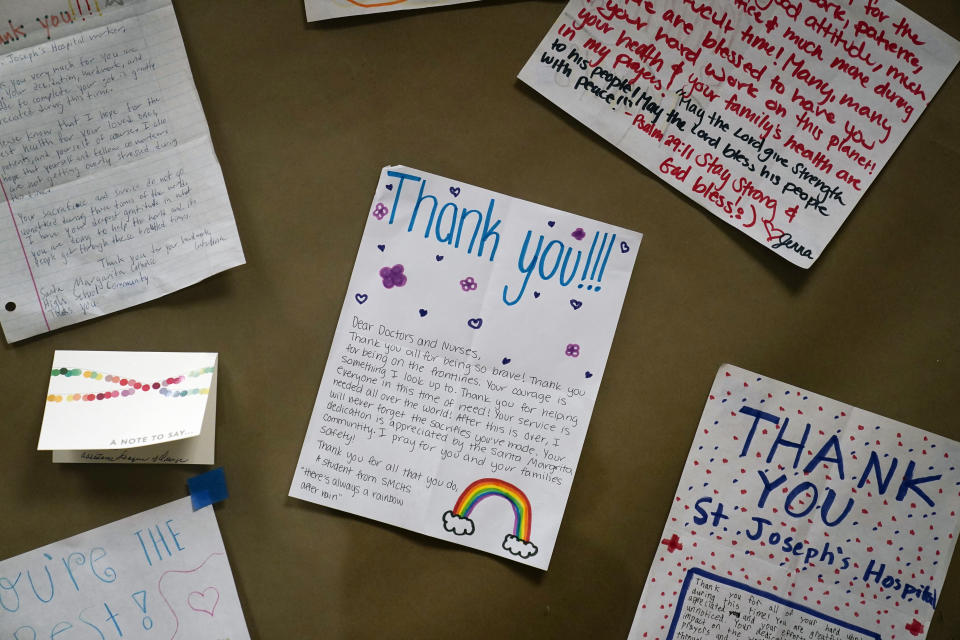 Thank you letters are posted on the wall in the lobby area of St. Joseph Hospital in Orange, Calif., Thursday, Jan. 7, 2021. California health authorities reported Thursday a record two-day total of 1,042 coronavirus deaths as many hospitals strain under unprecedented caseloads. The state's hospitals are trying to prepare for the possibility that they may have to ration care for lack of staff and beds — and hoping they don't have to make that choice. (AP Photo/Jae C. Hong)