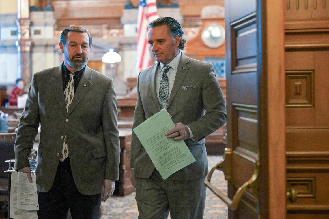 Sen. Virgil Peck, left, and Kansas Senate President Ty Masterson leave the Senate chamber after session on Tuesday in Topeka.