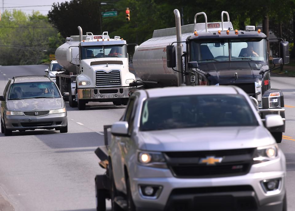 Tanker trucks and traffic on South Pine Street near the intersection of East Main Street on April 6, 2023. 