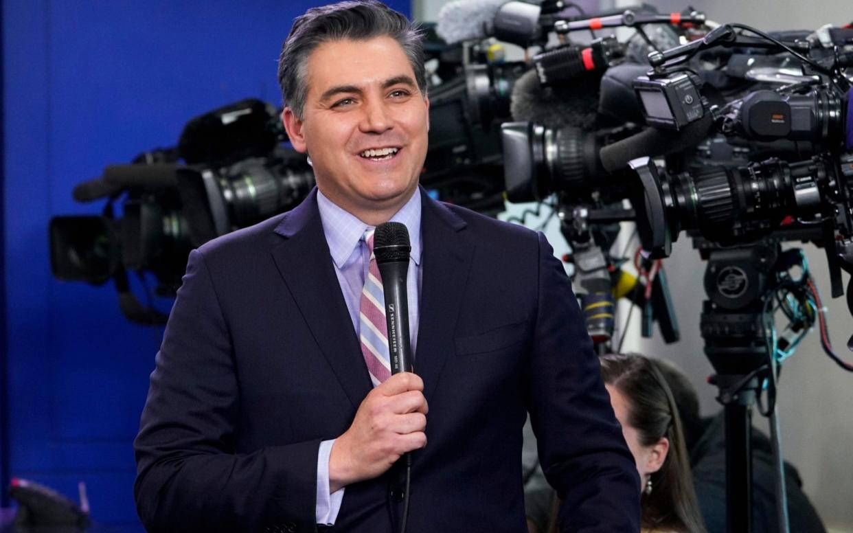 Jim Acota, the CNN reporter, had clashes with Donald Trump during a press conference - AFP