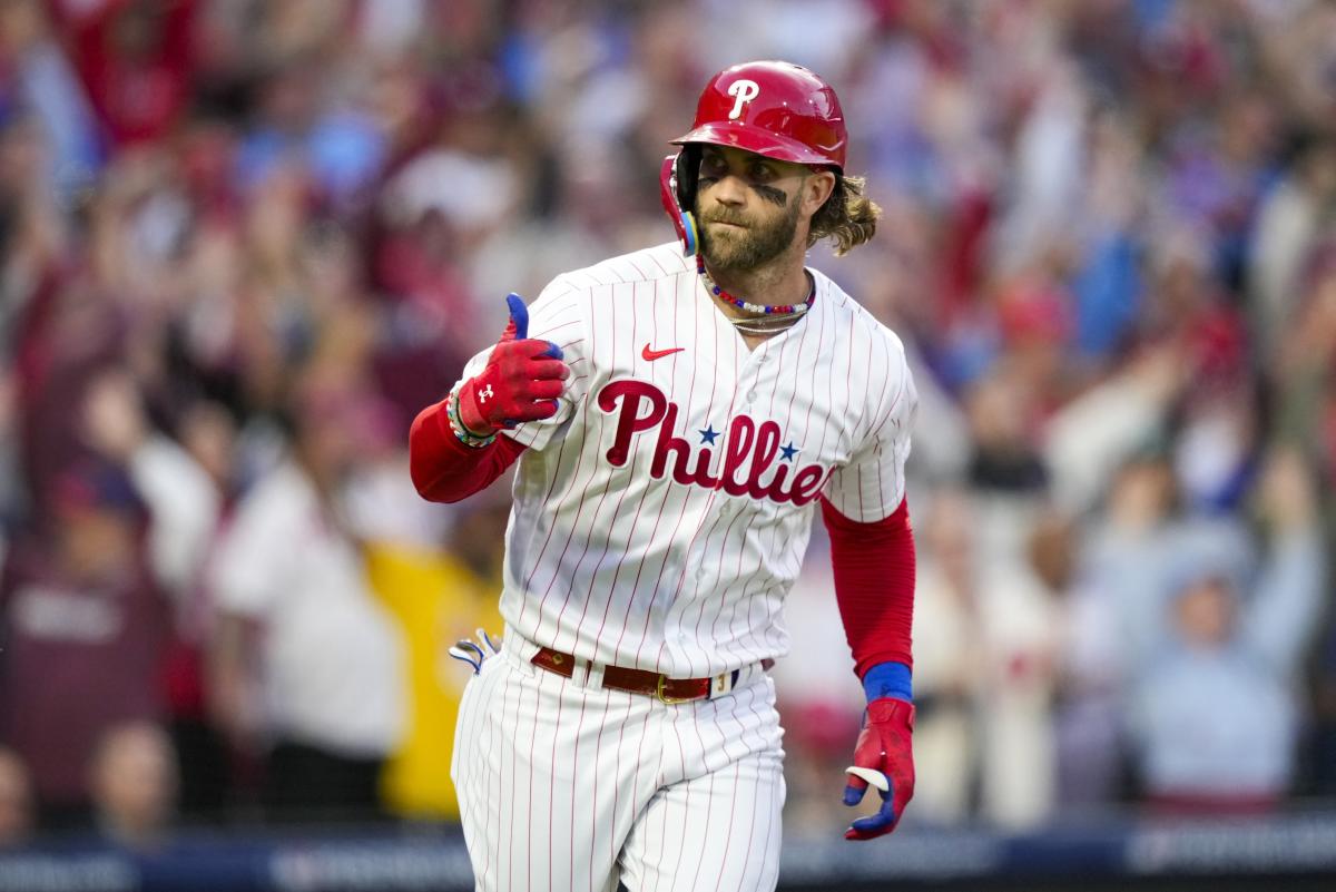 Phillies' Bryce Harper Signs His Helmet for a Young Fan After Being Ejected