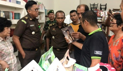 Indonesian officials seizing what they say were communism-related books in West Sumatra