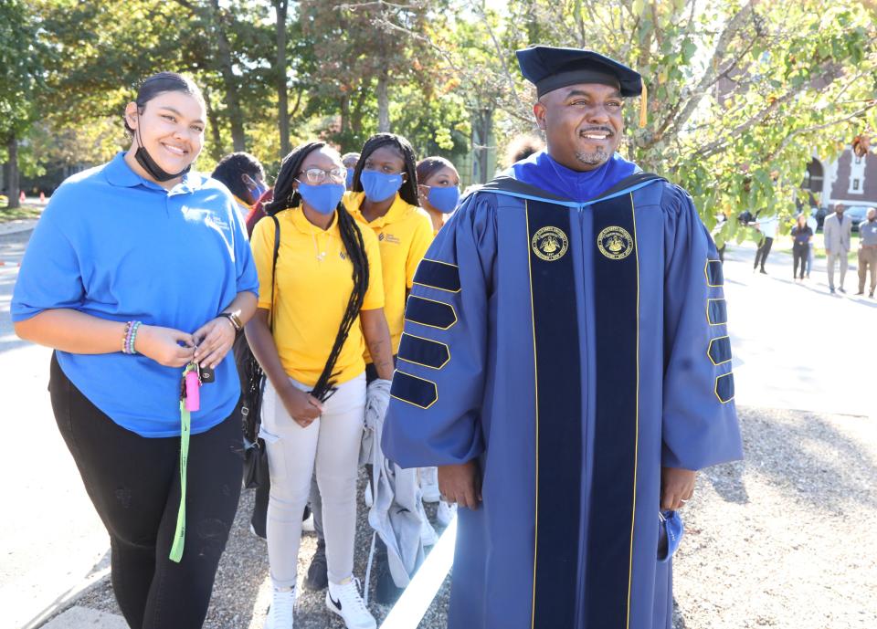 Dr. Gary Crosby stops to see some students during a procession ceremony to celebrate the installation of Dr. Gary Crosby as the first Black president of St. Elizabeth's University at their Morris Twp. campus on October 21, 2021.