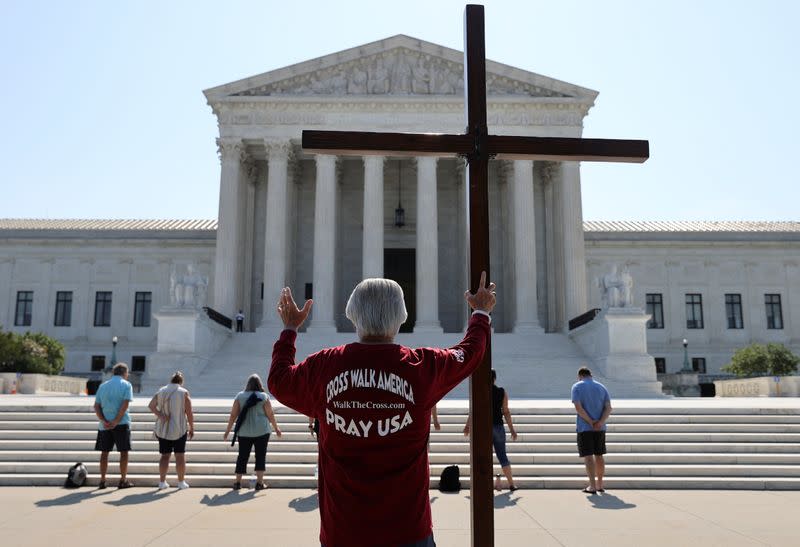 Demonstrators gather outside the U.S. Supreme Court in Washington