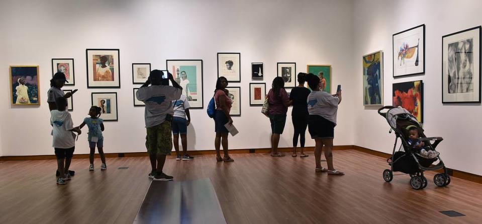 Families enjoy an exhibit at the Harvey B. Gantt Center for African-American Arts + Culture. The center has received grants from the Arts & Science Council.