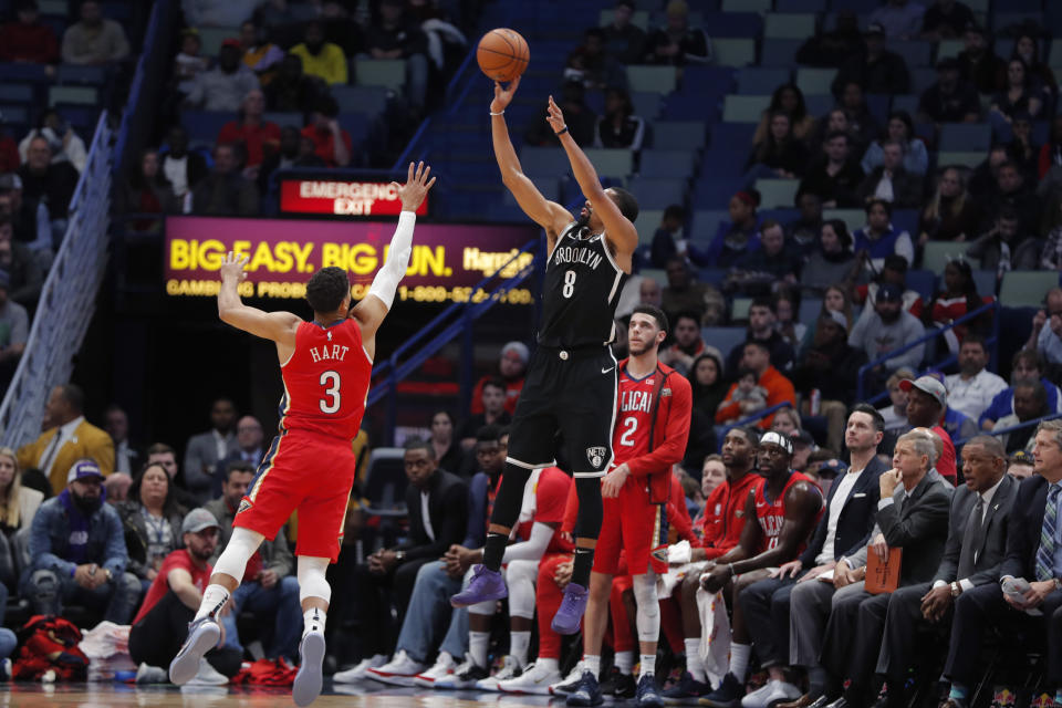 Brooklyn Nets guard Spencer Dinwiddie (8) attempts a 3-point shot against New Orleans Pelicans guard Josh Hart (3) in the first half of an NBA basketball game in New Orleans, Tuesday, Dec. 17, 2019. (AP Photo/Gerald Herbert)