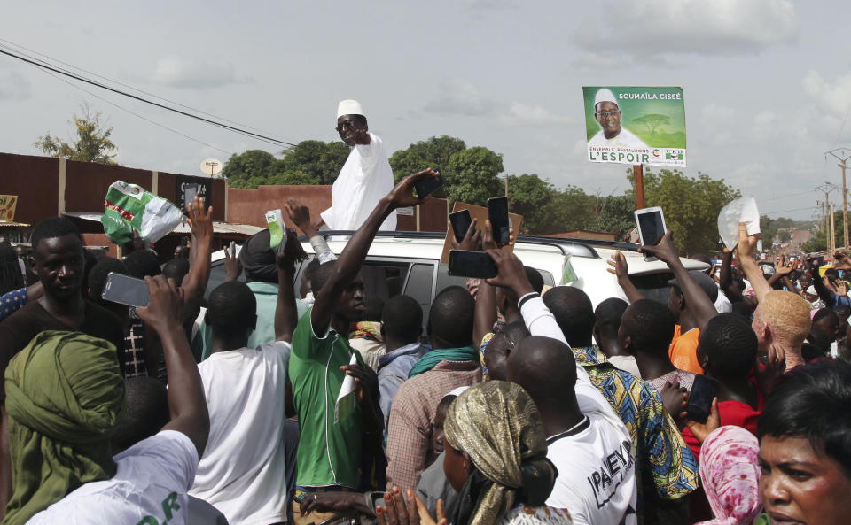 FILE- In this Monday, July 16, 2018, file photo, Soumaila Cisse, Opposition Presidential aspirant candidate of the Union for the Republic and Democracy party gestures during an election campaign rally in Yanfolila, Mali. Mali's opposition leader said Friday, Aug 17, 2018, he rejected results that proclaimed incumbent President Ibrahim Boubacar Keita the winner of a runoff presidential election. (AP Photo/Baba Ahmed, File)