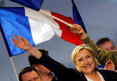 Marine Le Pen, French National Front (FN) political party leader and candidate for French 2017 presidential election, waves to supporters at the end of a political rally in Bordeaux, France, April 2, 2017. REUTERS/Regis Duvignau