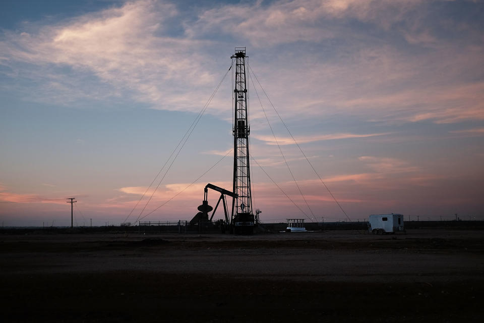 MIDLAND, TX - FEBRUARY 05: An oil drill is viewed near a construction site for homes and office buildings on February 5, 2015 in Midland, Texas. As crude oil prices have fallen nearly 60 percent globally, American communities dependent on oil revenue prepare for hard times. Texas, which benefited from hydraulic fracturing and the shale drilling revolution, tripled its production of oil in the last five years. The Texan economy saw hundreds of billions of dollars come into the state before the global plunge in prices. Across the state drilling budgets are being slashed and companies are notifying workers of upcoming layoffs. According to federal labor statistics, around 300,000 people work in the Texas oil and gas industry, 50 percent more than four years ago. (Photo by Spencer Platt/Getty Images)