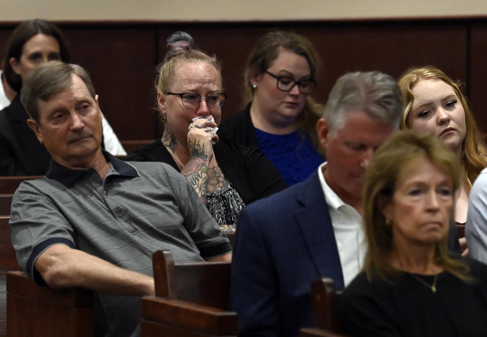 Family members of the victims listen to Sumner County District Attorney Lawrence Ray Whitley speak during a court hearing case of Michael Cummins at the Sumner County Justice Center on Wednesday, Aug. 16, 2023, in Gallatin Tenn. Cummins who killed eight people in rural Westmoreland over several days in April 2019, has pleaded guilty to eight counts of first-degree murder in exchange for a sentence of life without parole. (Mark Zaleski/The Tennessean via AP, Pool)