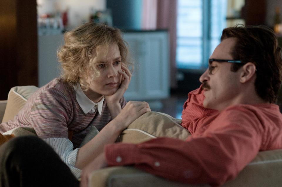 This image released by Warner Bros. Pictures shows Amy Adams, left, and Joaquin Phoenix in a scene from "Her." (AP Photo/Warner Bros. Pictures, Merrick Morton)