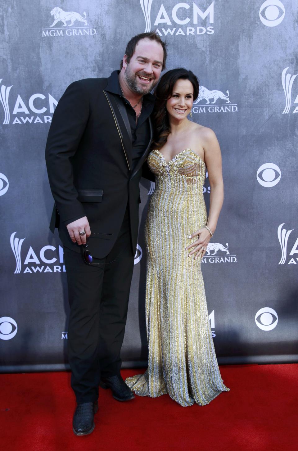 Country music artist Lee Brice and his wife Sara Reeveley arrive at the 49th Annual Academy of Country Music Awards in Las Vegas, Nevada April 6, 2014. REUTERS/Steve Marcus (UNITED STATES - Tags: ENTERTAINMENT) (ACMAWARDS-ARRIVALS)