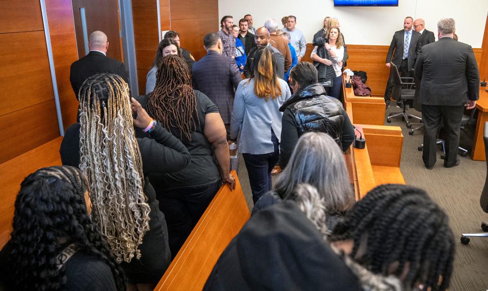 The family of Casey Goodson Jr. exits the courtroom Friday, Feb. 16, 2024, as members of former Franklin County Sheriff's deputy Michael Jason Meade's family wait following the declaration of a mistrial in Franklin County Common Pleas Court.