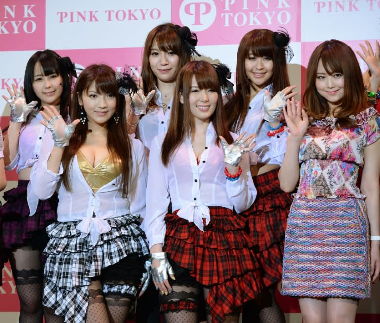 Porn actresses wave to fans at the opening of a 2014 sex toy fair in Tokyo