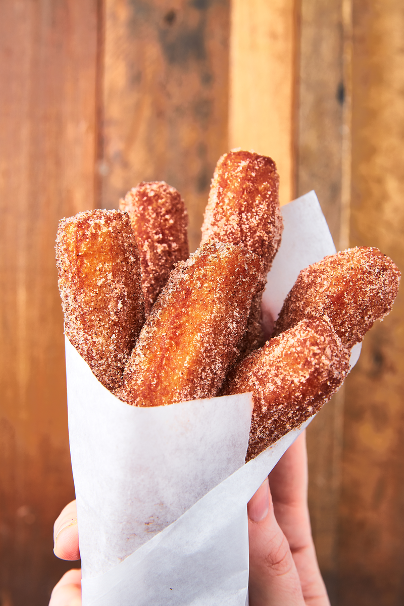 <p>We don't often feel like breaking out all of our oil to fry things. But when you have an easy churro recipe this delicious, it's absolutely worth it. They only take a few minutes to fry and will actually still taste good at room temp, making them a great party dessert! We are also just slightly obsessed with the chocolate dipping sauce. </p><p>Get the <a href="https://www.delish.com/uk/cooking/recipes/a29733984/easy-churros-recipe/" rel="nofollow noopener" target="_blank" data-ylk="slk:Homemade Churros;elm:context_link;itc:0;sec:content-canvas" class="link ">Homemade Churros</a> recipe.</p>